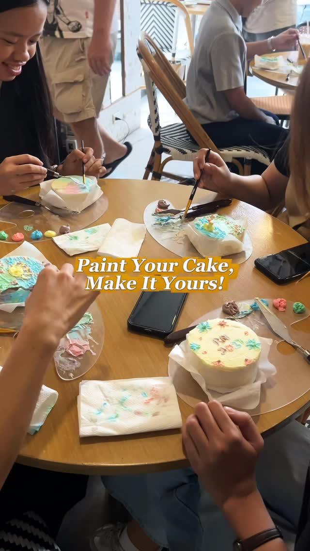 Friends painting cakes together at a table at Te'Amo Café in Cebu City