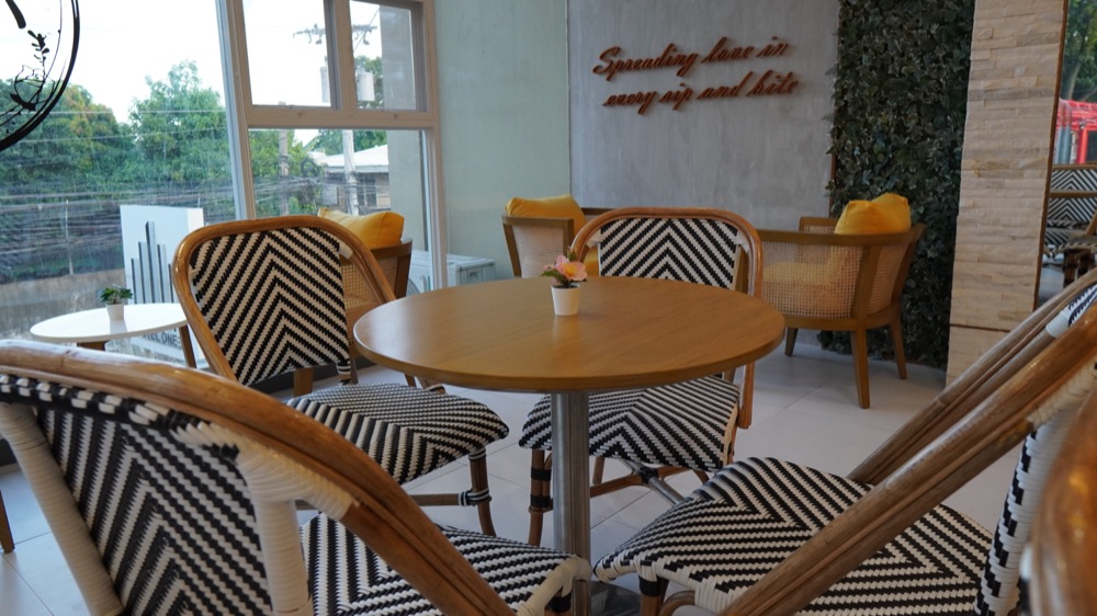 Seating with plants and big windows